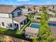 Backyard featuring a sparkling pool, covered patio, turf, and privacy landscaping, perfect for entertaining at 3415 E Arabian Dr, Gilbert, AZ 85296