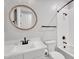 Well-lit bathroom featuring a decorative mirror, white vanity, and tub-shower combination at 3415 E Arabian Dr, Gilbert, AZ 85296