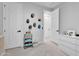 Bright bedroom with storage cart and open doorway at 3415 E Arabian Dr, Gilbert, AZ 85296