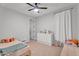 Cozy bedroom featuring a ceiling fan, neutral walls, and decor at 3415 E Arabian Dr, Gilbert, AZ 85296