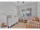 Bright bedroom with a white dresser, twin bed, and natural light from the window at 3415 E Arabian Dr, Gilbert, AZ 85296