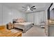 Stylish bedroom with a ceiling fan, decorative wall accents, and neutral-toned furnishings at 3415 E Arabian Dr, Gilbert, AZ 85296