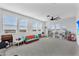 Large bonus room with multiple windows and a ceiling fan for added comfort at 3415 E Arabian Dr, Gilbert, AZ 85296