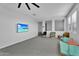 Open bonus room features a media center, seating area, and neutral wall color at 3415 E Arabian Dr, Gilbert, AZ 85296