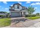 Inviting home exterior with a brick driveway, lush lawn, and manicured landscaping at 3415 E Arabian Dr, Gilbert, AZ 85296