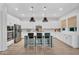 Modern kitchen with white cabinetry, a kitchen island, and stainless steel appliances at 3415 E Arabian Dr, Gilbert, AZ 85296