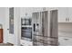 Stainless steel refrigerator and modern built-in oven highlight this kitchen's contemporary design at 3415 E Arabian Dr, Gilbert, AZ 85296