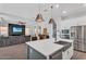 Open concept kitchen with stainless appliances, a large island, and seamless flow into the living area at 3415 E Arabian Dr, Gilbert, AZ 85296
