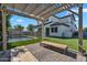 Open-air patio with pergola overlooking the fenced pool and manicured lawn, perfect for outdoor entertaining at 3415 E Arabian Dr, Gilbert, AZ 85296
