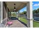 Covered patio showcasing brick pavers, ceiling fans, and open views of the backyard and pool at 3415 E Arabian Dr, Gilbert, AZ 85296