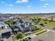 Neighborhood street view showing a well-maintained home, lush landscaping, and community charm at 3415 E Arabian Dr, Gilbert, AZ 85296