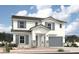 Two-story home with gray shutters and a gray garage door, and a stone pillar entry in a suburban community at 36875 W Santa Maria St St, Maricopa, AZ 85138