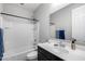 Bathroom featuring a shower-tub combo and a vanity at 42180 W Cheyenne Dr, Maricopa, AZ 85138