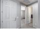 Entryway with neutral gray walls, offering a view into adjacent rooms at 42180 W Cheyenne Dr, Maricopa, AZ 85138