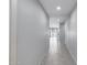 Hallway with grey walls and recessed lighting, connecting different areas of the home at 42180 W Cheyenne Dr, Maricopa, AZ 85138
