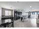 Spacious living area featuring an open floor plan and seamless integration with the modern kitchen at 42180 W Cheyenne Dr, Maricopa, AZ 85138