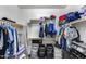 Walk-in closet with ample hanging space, shelving, and organization for clothing and accessories at 42180 W Cheyenne Dr, Maricopa, AZ 85138