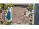 Overhead aerial showcasing a home with a tiled roof, pool, patio, and landscaped yard, providing a private outdoor oasis at 4305 S Antonio --, Mesa, AZ 85212