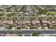 Wide aerial view showing a residential neighborhood with well-maintained homes, landscaping, and streetscapes under a sunny sky at 4305 S Antonio --, Mesa, AZ 85212