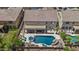Aerial view of a backyard featuring a pool, patio with outdoor seating, and well-manicured landscaping creating a relaxing retreat at 4305 S Antonio --, Mesa, AZ 85212