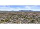 Expansive aerial view of a residential community nestled in a desert landscape with mountains visible in the background at 4305 S Antonio --, Mesa, AZ 85212