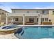Inviting backyard features a pristine pool, spa, and covered seating area at 4305 S Antonio --, Mesa, AZ 85212