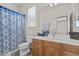 Cozy bathroom showcases a window, a toilet, and cabinet storage space at 4305 S Antonio --, Mesa, AZ 85212
