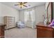 Bright bedroom with chair and ottoman, neutral carpet, blinds, and natural light at 4305 S Antonio --, Mesa, AZ 85212
