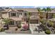 Charming home with a tile roof, desert landscaping, a two-car garage, and a sunny sky at 4305 S Antonio --, Mesa, AZ 85212