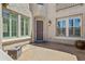 Inviting front porch with stone accents, a dark-wood door, and plenty of natural light at 4305 S Antonio --, Mesa, AZ 85212