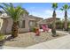 Beautiful home with desert landscaping, palm trees, and a vibrant blue sky at 4305 S Antonio --, Mesa, AZ 85212