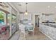 Kitchen view with a dining nook, white cabinets, and granite countertops at 4305 S Antonio --, Mesa, AZ 85212