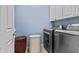 Laundry room features updated appliances and additional storage cabinet at 4305 S Antonio --, Mesa, AZ 85212