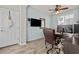 Cozy office space with wood floors, natural light, and an organized desk area at 4305 S Antonio --, Mesa, AZ 85212