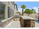 Outdoor kitchen boasts a grill and stone counter, perfect for entertaining at 4305 S Antonio --, Mesa, AZ 85212