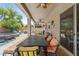 Relaxing covered patio includes comfortable seating, table, and ceiling fans at 4305 S Antonio --, Mesa, AZ 85212