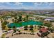Aerial view of the neighborhood featuring walking paths, lake, and community garden at 4337 S Helix --, Mesa, AZ 85212