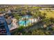 Aerial view showcases a stunning pool area surrounded by lush landscaping and palm trees at 4337 S Helix --, Mesa, AZ 85212