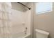 Clean bathroom with a shower and tub, toilet, and a window for natural light at 4337 S Helix --, Mesa, AZ 85212