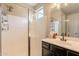 A modern bathroom featuring a shower and dark cabinetry with a vessel sink at 4337 S Helix --, Mesa, AZ 85212