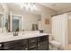 Bathroom featuring a bath and shower, white countertop and dark cabinets with gold hardware at 4337 S Helix --, Mesa, AZ 85212
