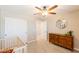 A Bedroom featuring soft carpeting, a ceiling fan, closet doors, and dresser with decor at 4337 S Helix --, Mesa, AZ 85212