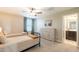 Bright bedroom features two twin beds, a dresser, and an ensuite bathroom at 4337 S Helix --, Mesa, AZ 85212