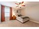 Bright bedroom with neutral tones, a ceiling fan, and a window letting in natural light at 4337 S Helix --, Mesa, AZ 85212