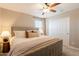 Cozy bedroom featuring soft carpeting, a ceiling fan, and comfortable neutral-toned bedding at 4337 S Helix --, Mesa, AZ 85212