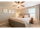 Bedroom featuring soft carpeting, a ceiling fan, comfortable neutral-toned bedding, and bedside tables at 4337 S Helix --, Mesa, AZ 85212
