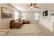 Comfortable bonus room with a stylish rug, sectional sofa, and built-in shelving at 4337 S Helix --, Mesa, AZ 85212