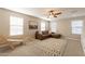 Cozy bonus room with a leather sectional couch and a patterned rug for relaxing at 4337 S Helix --, Mesa, AZ 85212