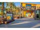 A modern building with a trellis entrance, surrounded by desert landscaping and palm trees at 4337 S Helix --, Mesa, AZ 85212