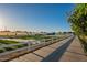 Community garden featuring fresh produce, white fencing, and walking path at 4337 S Helix --, Mesa, AZ 85212